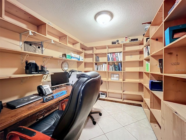 office space with light tile patterned floors and a textured ceiling