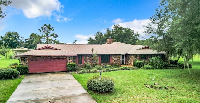 single story home with a garage and a front lawn