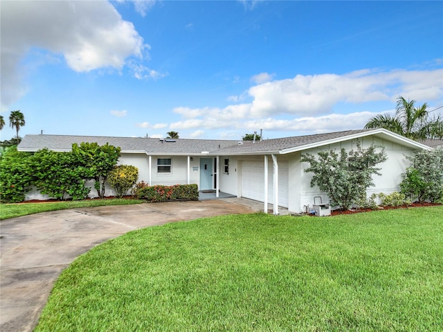 single story home featuring a front yard and a garage