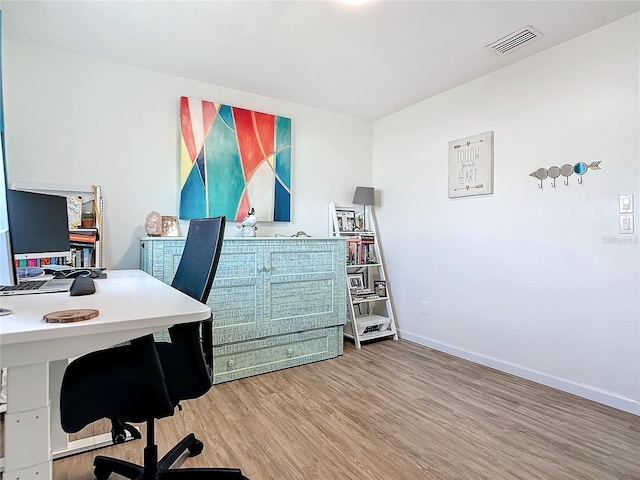 home office featuring hardwood / wood-style floors