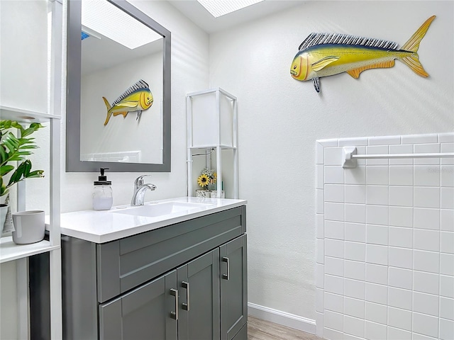 bathroom featuring vanity and hardwood / wood-style floors