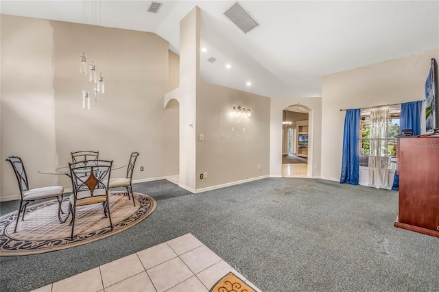 interior space featuring lofted ceiling and light colored carpet