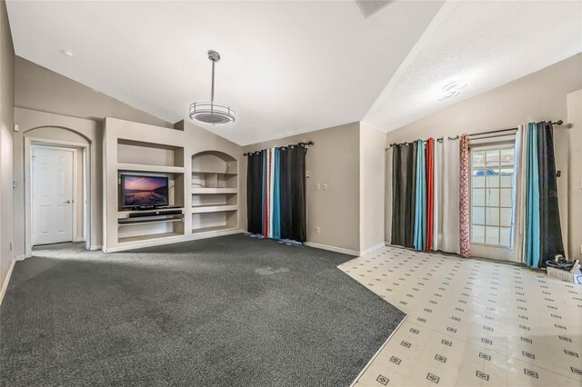 unfurnished living room with carpet, lofted ceiling, a textured ceiling, and built in features