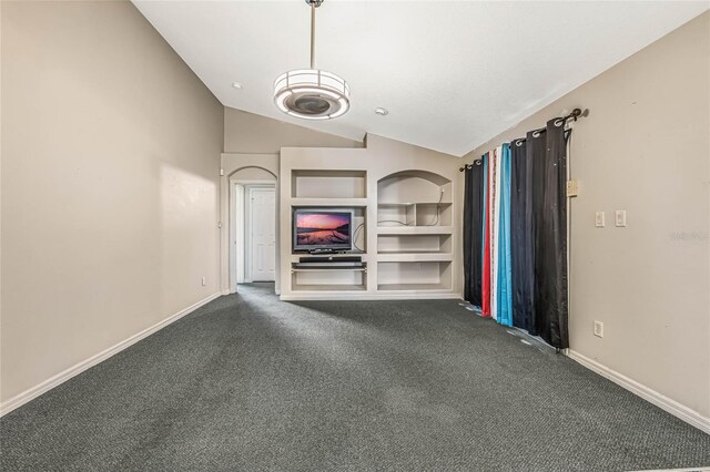 unfurnished living room with carpet, lofted ceiling, and built in shelves