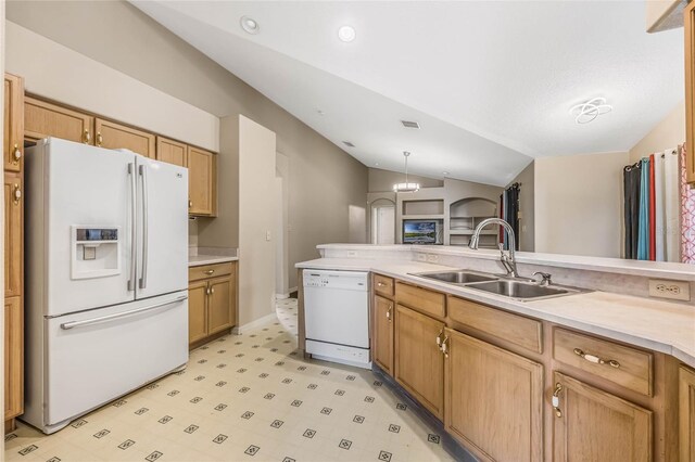 kitchen featuring sink, white appliances, decorative light fixtures, a chandelier, and vaulted ceiling