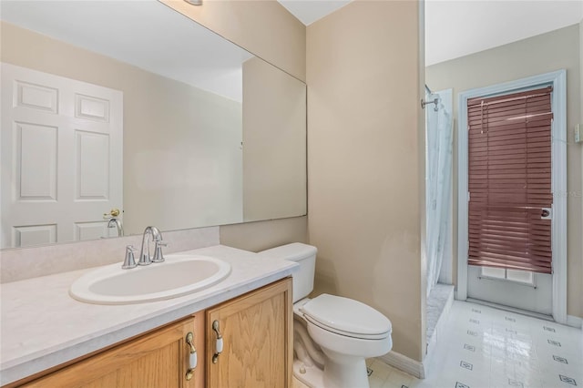 bathroom with a shower with shower curtain, vanity, toilet, and tile patterned floors