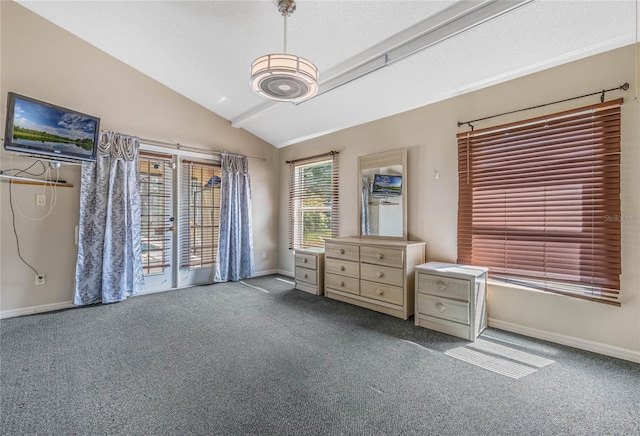 unfurnished bedroom featuring lofted ceiling and carpet