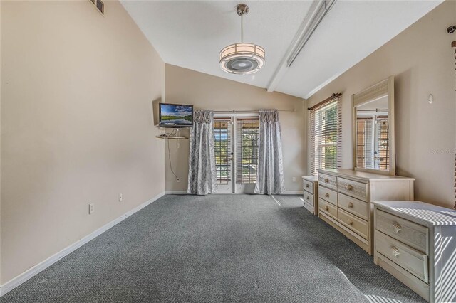 carpeted bedroom with vaulted ceiling