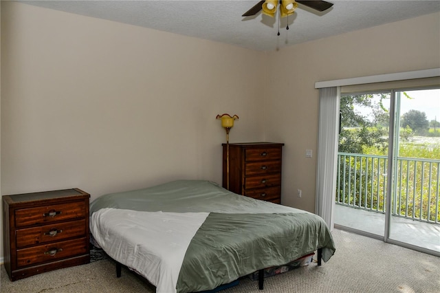 bedroom with ceiling fan, a textured ceiling, light carpet, and access to exterior