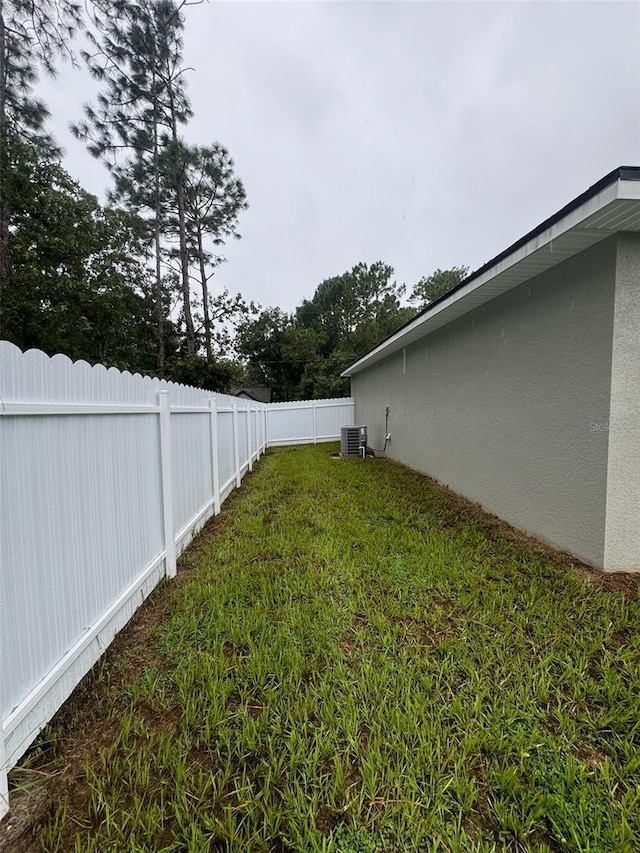 view of yard featuring central AC