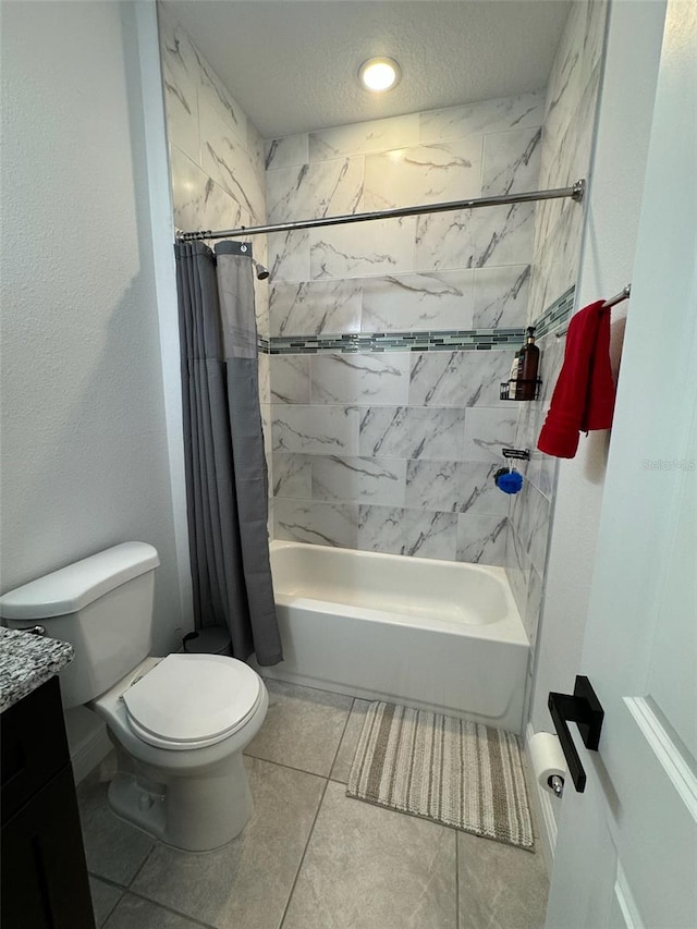 full bathroom featuring vanity, a textured ceiling, tile patterned flooring, shower / tub combo with curtain, and toilet