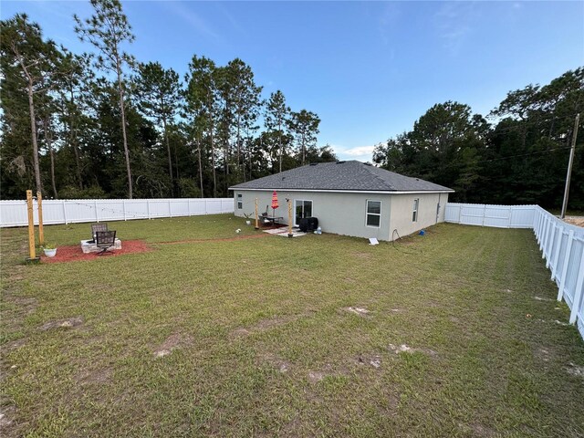 view of yard featuring a patio area and a fire pit