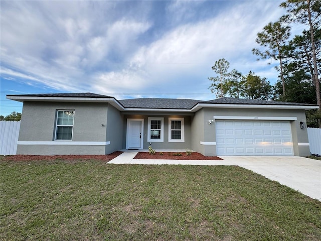 single story home with a garage and a front lawn