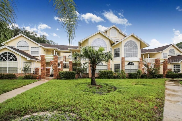 front facade with a front lawn