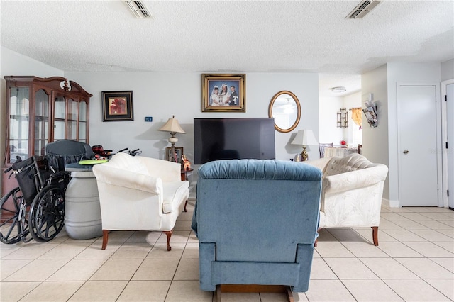 tiled living room with a textured ceiling