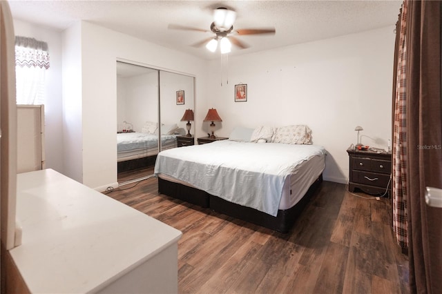 bedroom with ceiling fan, a textured ceiling, a closet, and dark hardwood / wood-style flooring