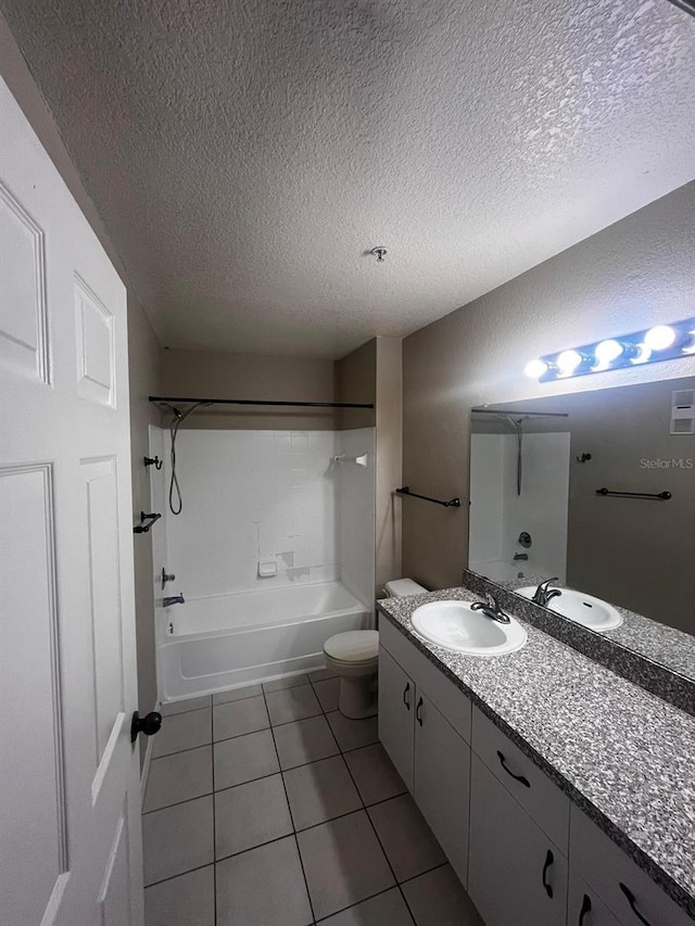 full bathroom featuring vanity, toilet, a textured ceiling, shower / tub combination, and tile patterned flooring