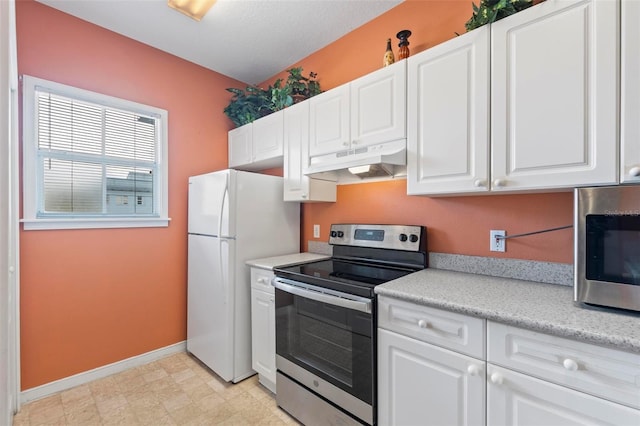 kitchen featuring stainless steel appliances and white cabinetry