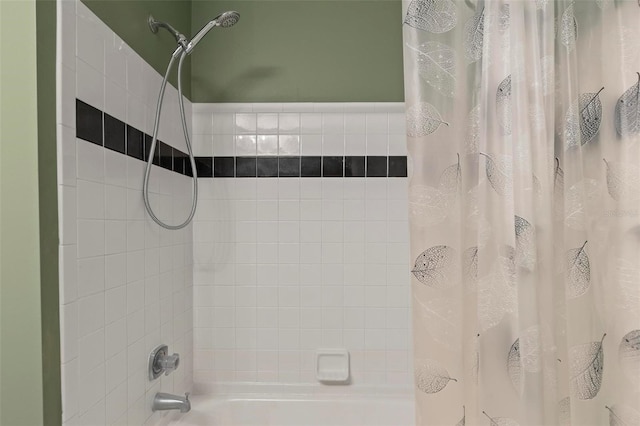 bathroom with shower / bath combo