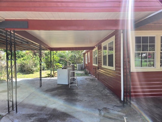 view of patio / terrace with washer / dryer and central AC unit