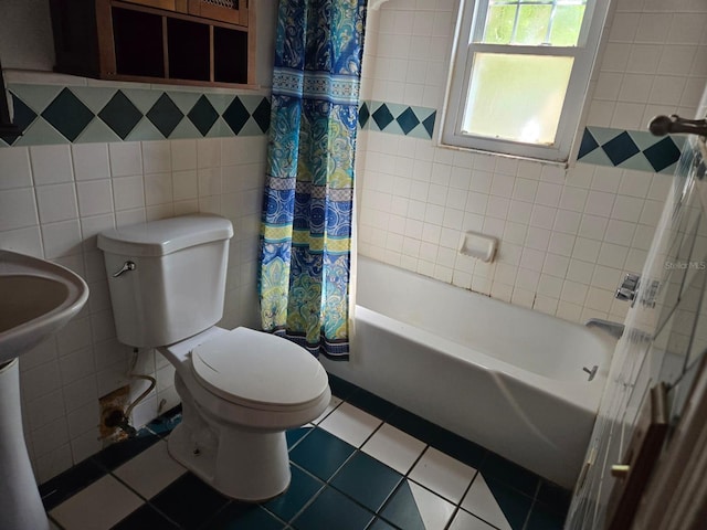 bathroom featuring tile walls, tile patterned flooring, toilet, and shower / bath combination with curtain