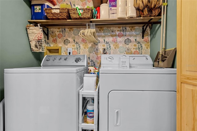 laundry area with independent washer and dryer