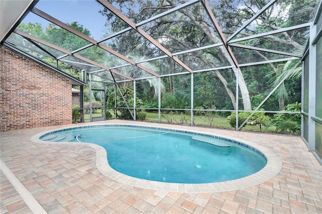 view of pool featuring a lanai and a patio area