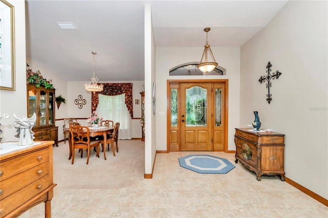 entrance foyer with a notable chandelier