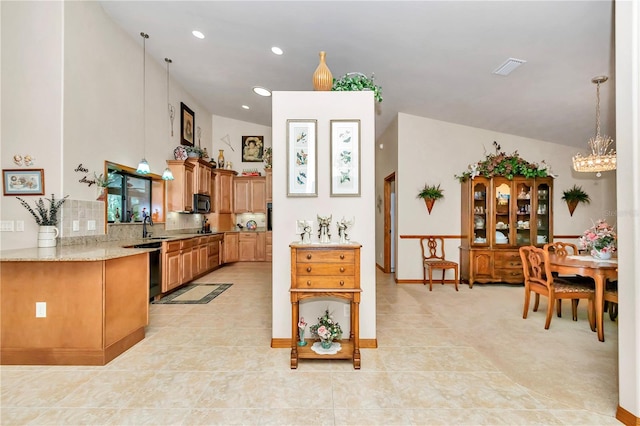 kitchen with dishwasher, decorative backsplash, lofted ceiling, and light tile patterned floors