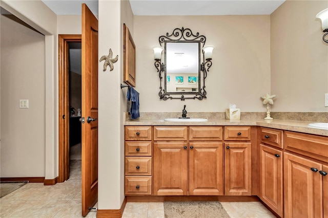 bathroom featuring tile patterned flooring and vanity