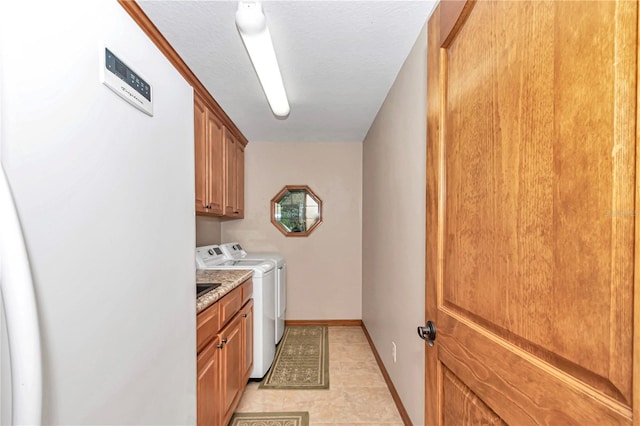 washroom with cabinets and separate washer and dryer