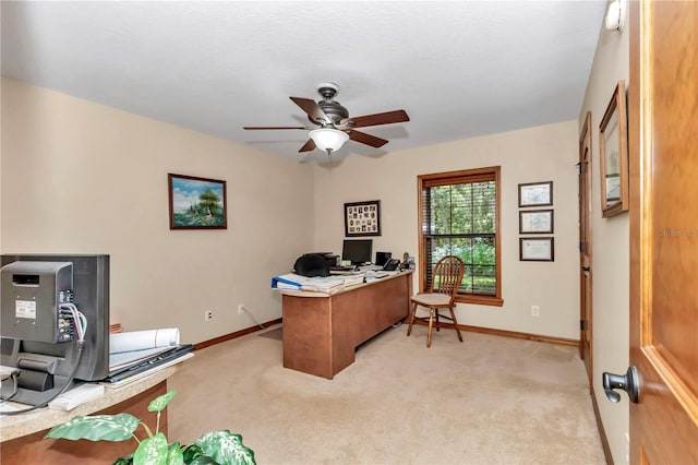 office space with light colored carpet and ceiling fan