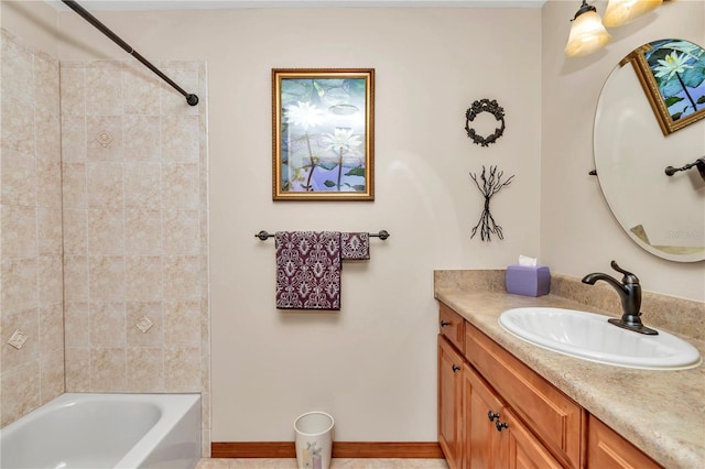 bathroom with vanity and tiled shower / bath