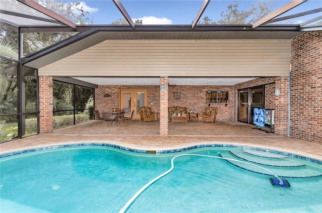 view of pool featuring a patio and french doors