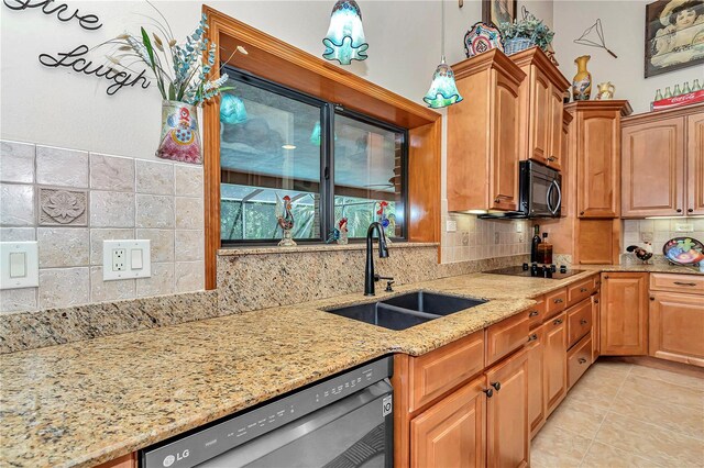 kitchen with black appliances, sink, decorative backsplash, light tile patterned floors, and light stone counters