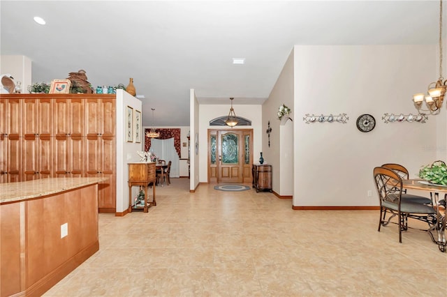 entrance foyer with a notable chandelier