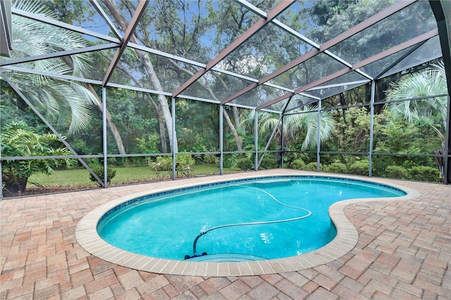 view of pool featuring a lanai and a patio