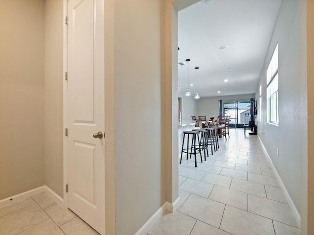 hallway with light tile patterned floors