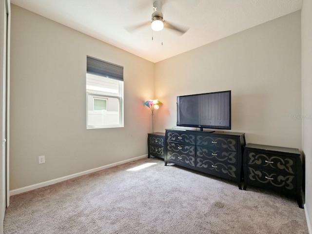 carpeted bedroom with ceiling fan