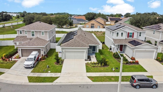 view of front of property with a front lawn and a garage