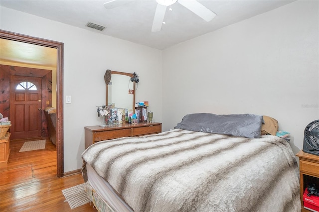 bedroom featuring light hardwood / wood-style floors and ceiling fan