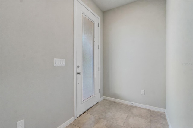 entryway with light tile patterned floors