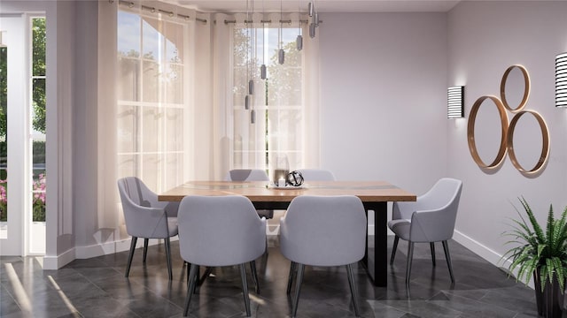 dining space with dark tile patterned floors