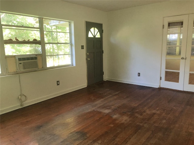 foyer featuring cooling unit, dark hardwood / wood-style floors, and french doors