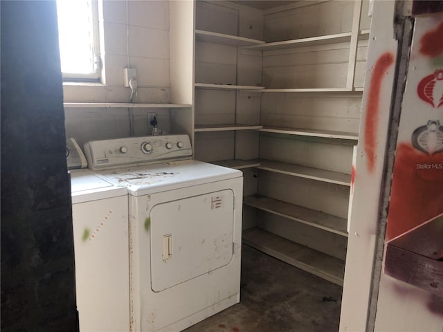 laundry area featuring washing machine and clothes dryer