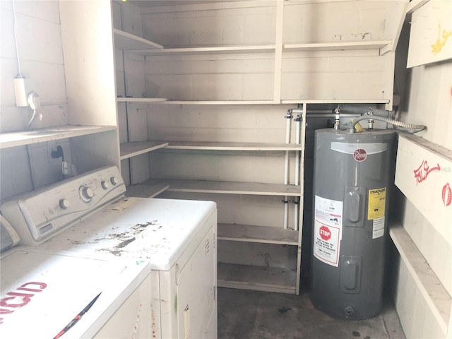 clothes washing area with electric water heater and washer and clothes dryer