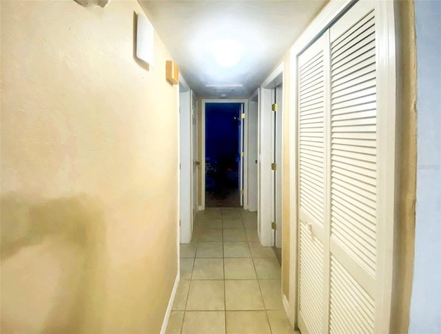 corridor featuring light tile patterned floors