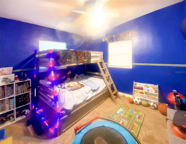 bedroom with ceiling fan and carpet floors