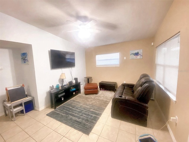 tiled living room with ceiling fan