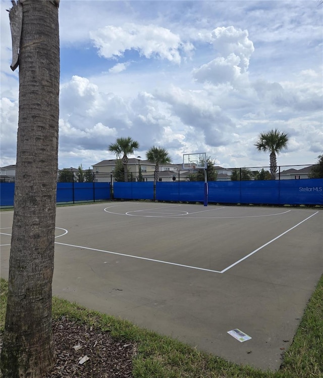 view of tennis court featuring basketball court